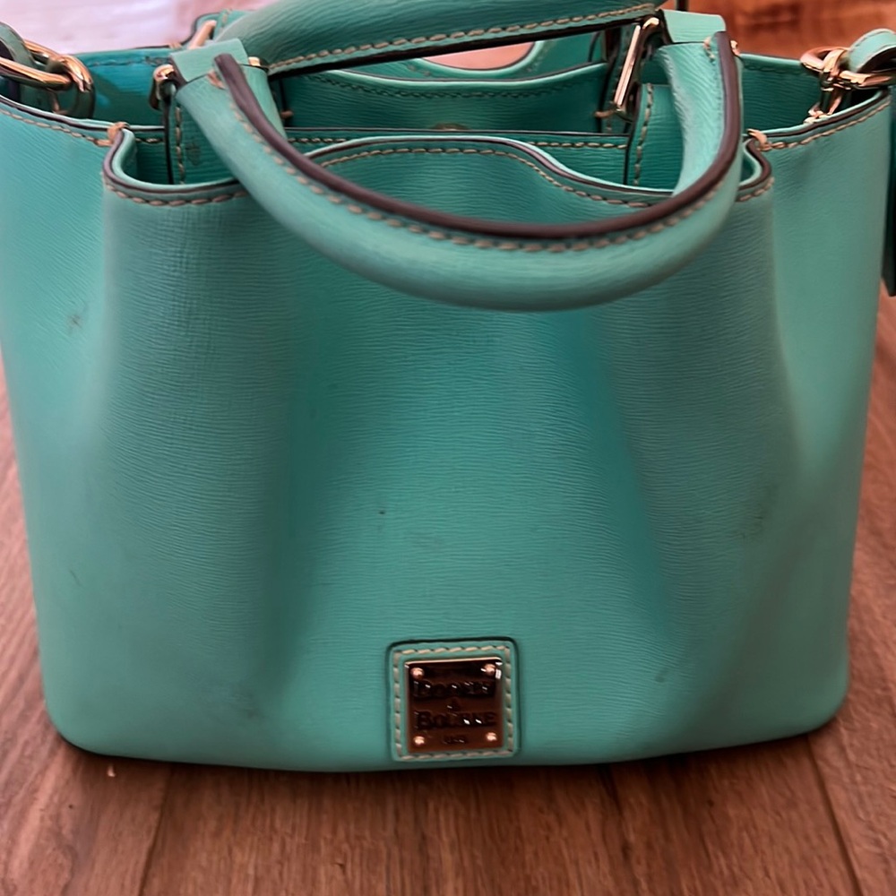Private listing Dooney and Burke Crossbody handbag. Teal color
